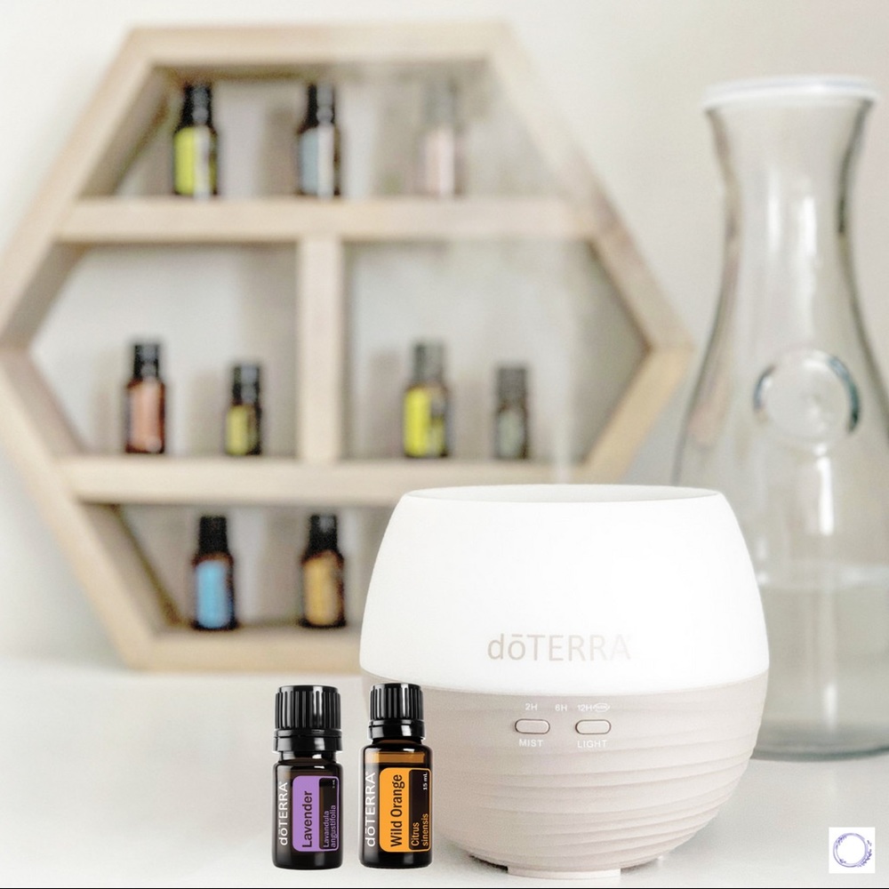 NEW DōTERRA Diffuser with two essential oils.